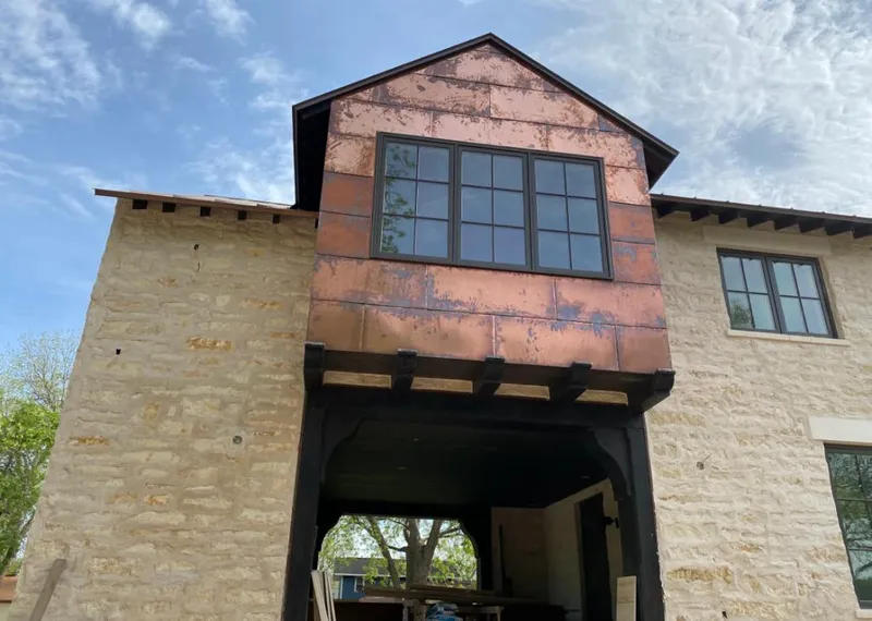 Copper metal panel facade on a stone building for Metal Roof Coating in Paradise